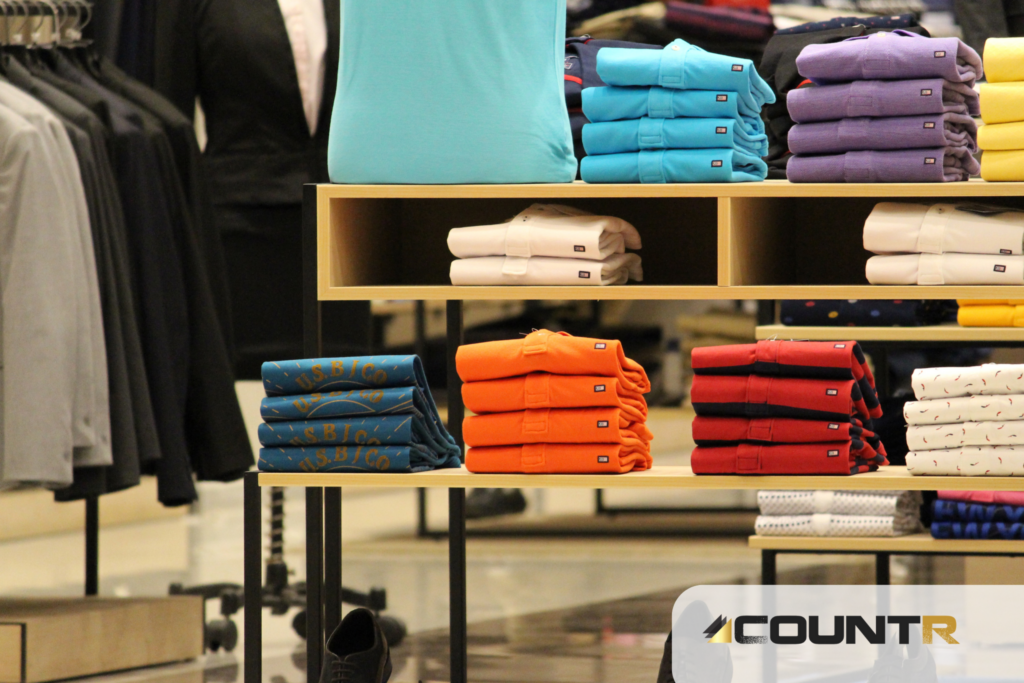 Folded shirts in a retail store, representing how CountR data supports better product placement in high-engagement zones