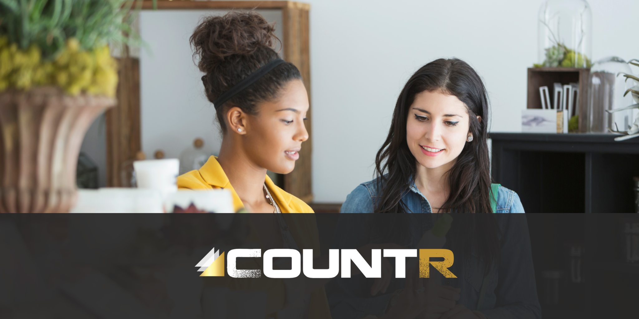 Retail staff advising a shopper on a product, demonstrating how CountR analytics optimize staffing during key customer moments