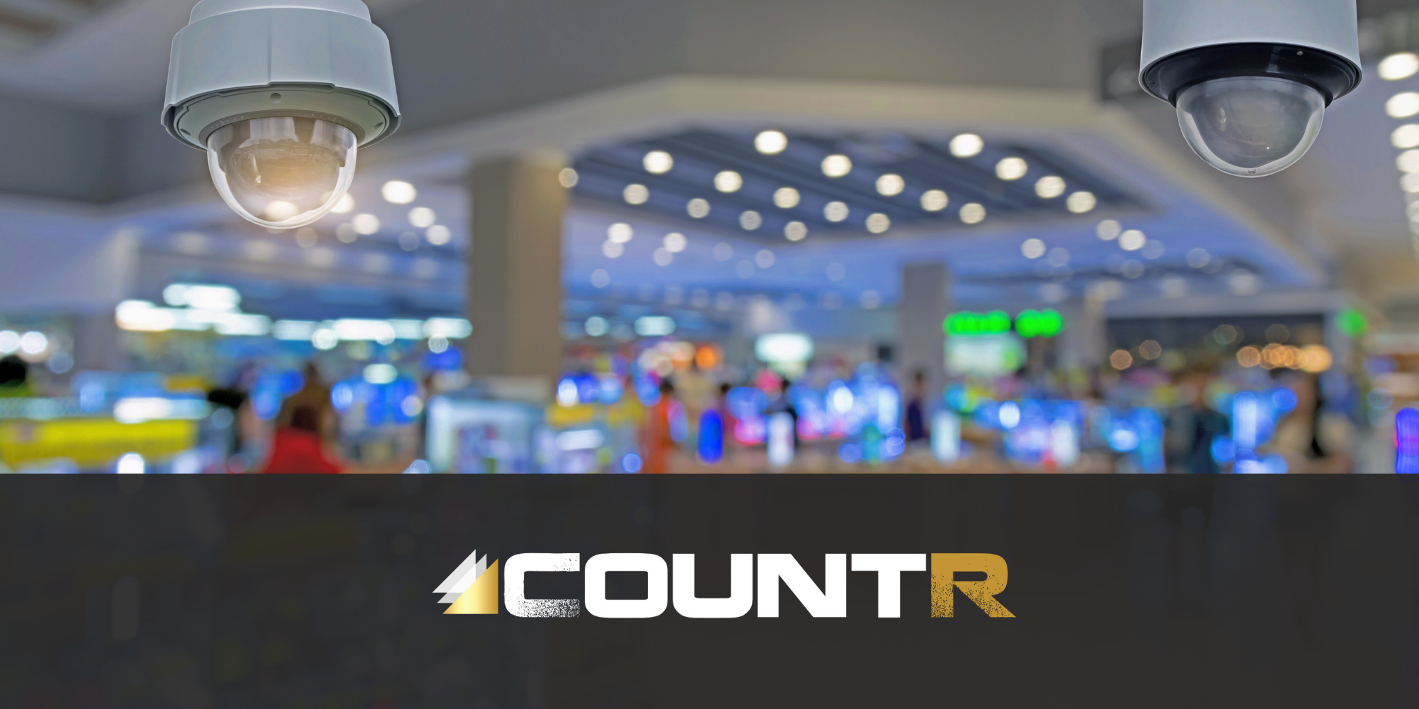 CountR In-Store Analytics – Smart Camera Integration Close-up of security cameras in a retail store with CountR logo overlay.