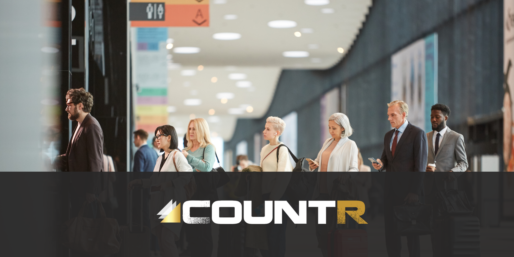 Travelers waiting in line at an airport terminal with CountR logo overlay