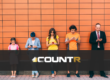 Group of people of different ages using smartphones, representing customer demographics with CountR retail analytics logo